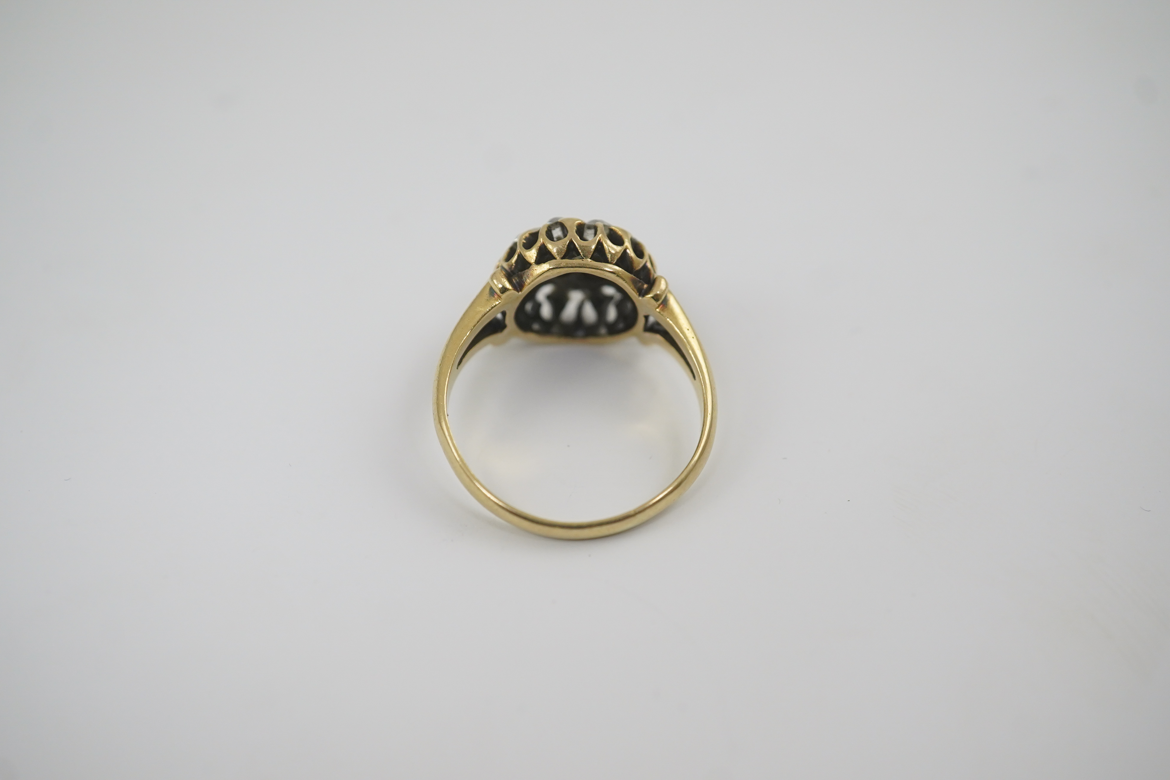 An early to mid 20th century gold and diamond set circular cluster ring